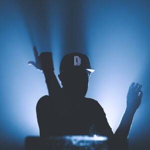 silhouette of man wearing black cap